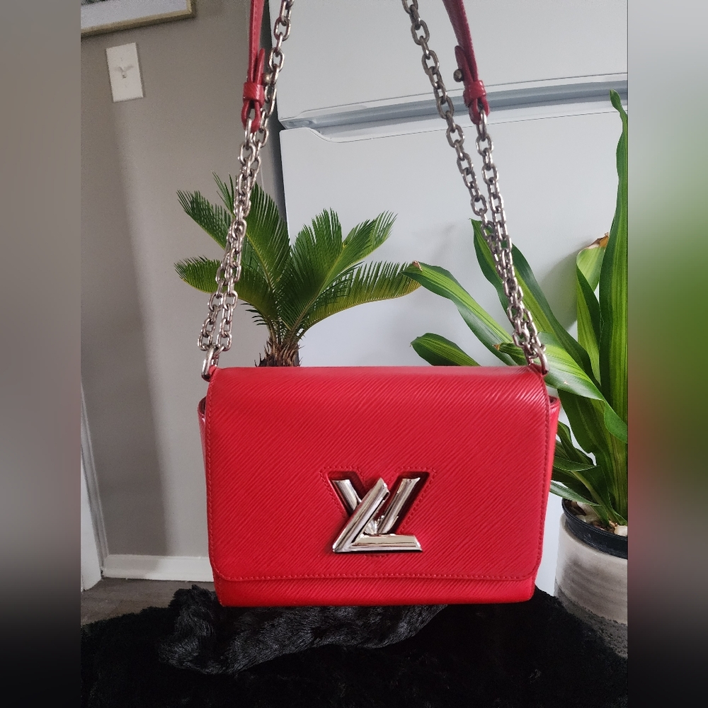 Authentic Louis Vuitton Red Epi Leather twisted bag